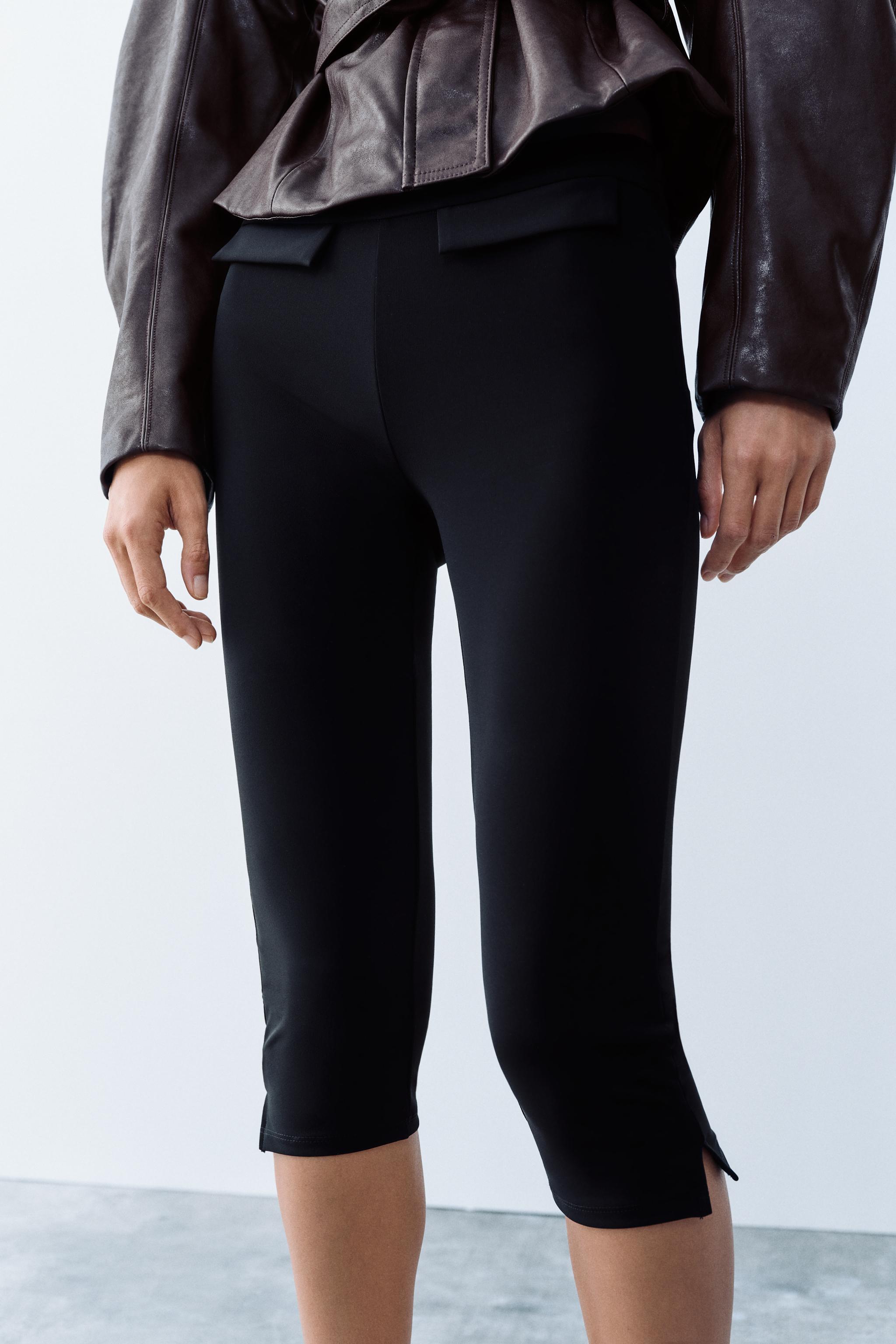 VESTE À CEINTURE EN MATIÈRE SYNTHÉTIQUE